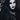 Pale, luminous gothic makeup look with dramatic dark eyes and jewellery, illustrating the vampire skin trend